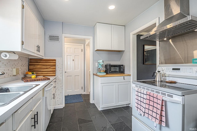 1919 Kessler Blvd, South Bend, IN 46616 - kitchen with white electric range oven, wall chimney range hood, white cabinetry, light countertops, and recessed lighting