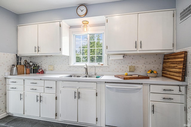 1919 Kessler Blvd, South Bend, IN 46616 - kitchen with white dishwasher, a sink, white cabinetry, light countertops, and tasteful backsplash