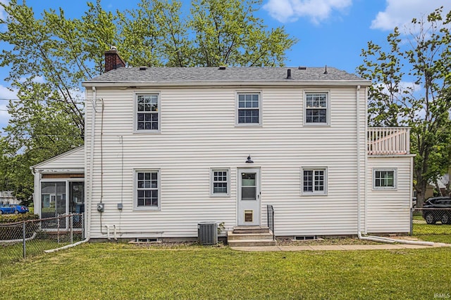1919 Kessler Blvd, South Bend, IN 46616 - back of property featuring entry steps, a chimney, central AC, and a sunroom