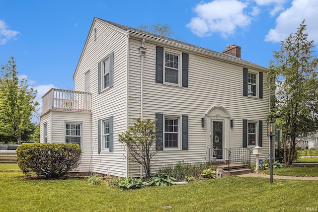 1919 Kessler Blvd, South Bend, IN 46616 - colonial home with a chimney and a front lawn