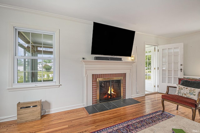 1919 Kessler Blvd, South Bend, IN 46616 - living area featuring wood finished floors, crown molding, a brick fireplace, and baseboards