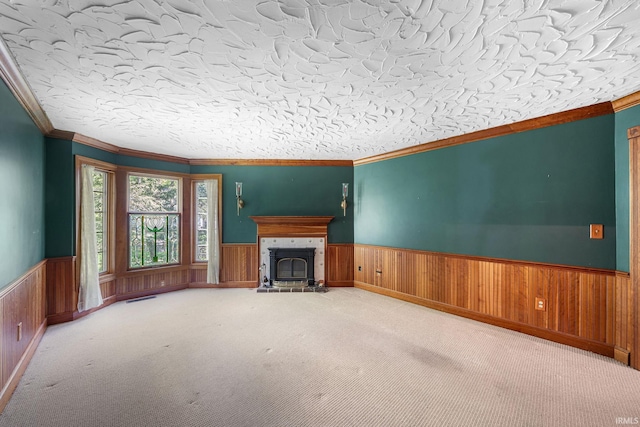 3619 Sullivan Ct, South Bend, IN 46614 - unfurnished living room with a wainscoted wall, ornamental molding, carpet flooring, a fireplace with raised hearth, and wooden walls