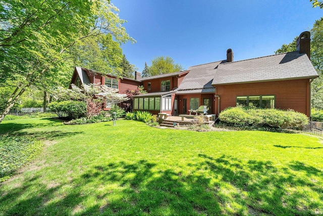 3619 Sullivan Ct, South Bend, IN 46614 - back of house with a chimney and a sunroom