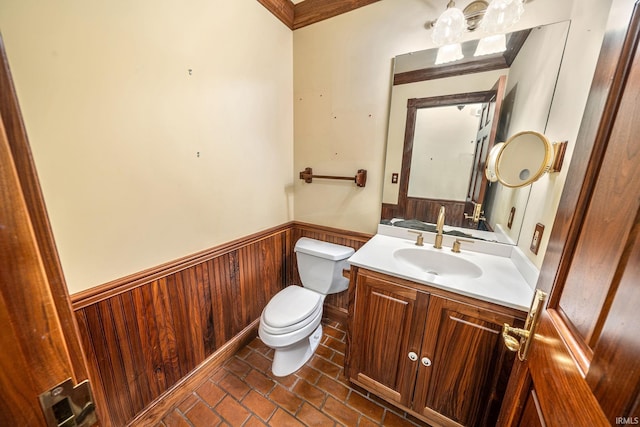 3619 Sullivan Ct, South Bend, IN 46614 - bathroom with toilet, wainscoting, vanity, brick flooring, and wood walls
