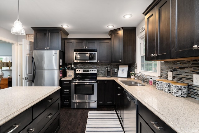 3599 Canterbury Dr, Lafayette, IN 47909 - kitchen with stainless steel appliances, a sink, backsplash, dark wood-type flooring, and recessed lighting