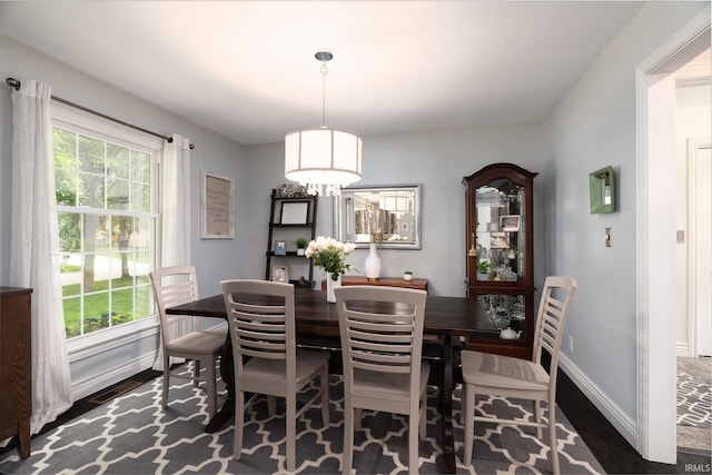 3599 Canterbury Dr, Lafayette, IN 47909 - dining space featuring wood finished floors, baseboards, and a chandelier