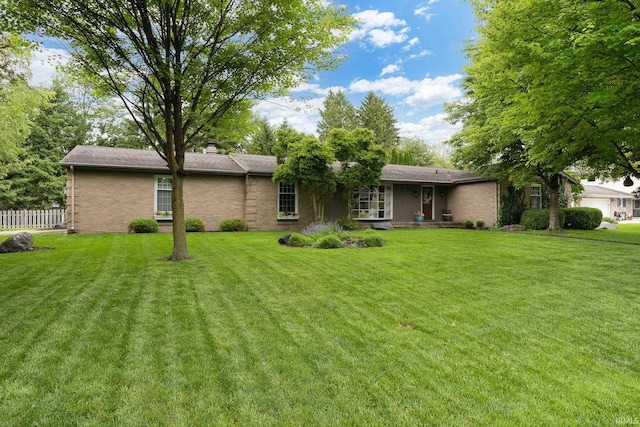 3599 Canterbury Dr, Lafayette, IN 47909 - back of property with a chimney and brick siding