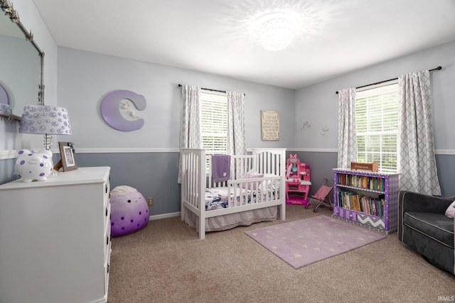 3599 Canterbury Dr, Lafayette, IN 47909 - carpeted bedroom featuring multiple windows and a nursery area