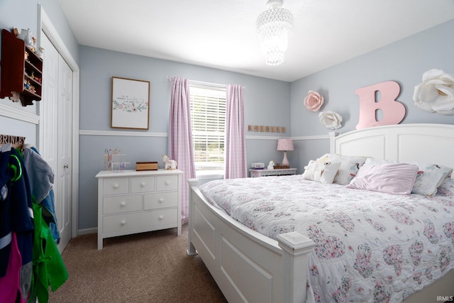 3599 Canterbury Dr, Lafayette, IN 47909 - bedroom with dark carpet, a chandelier, and a closet