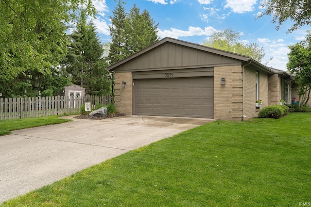 3599 Canterbury Dr, Lafayette, IN 47909 - view of front of home with brick siding, a garage, and driveway
