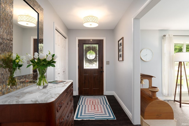 3599 Canterbury Dr, Lafayette, IN 47909 - foyer featuring baseboards and dark wood-style flooring