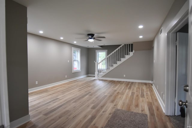 1602 Etna Ave, Huntington, IN 46750 - unfurnished room with ceiling fan, stairway, recessed lighting, baseboards, and light wood-style flooring