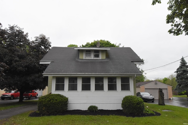 1602 Etna Ave, Huntington, IN 46750 - view of front of house with a detached garage and an outbuilding