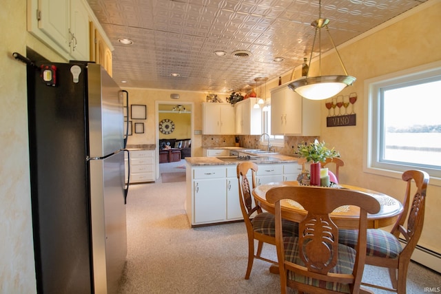 6064 E 300 N, Union City, IN 47390 - kitchen featuring freestanding refrigerator, a sink, an ornate ceiling, light countertops, and light carpet