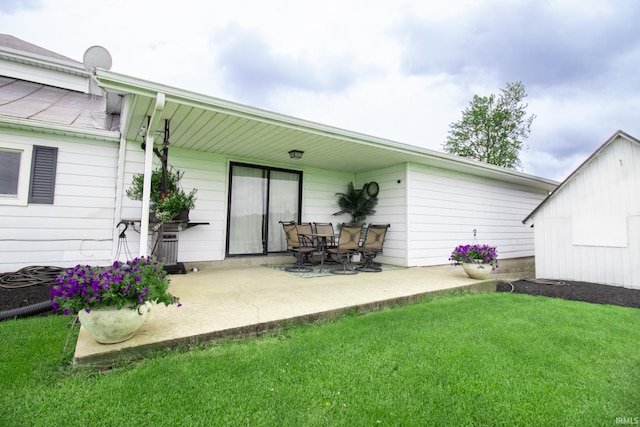 6064 E 300 N, Union City, IN 47390 - back of property featuring a patio area and a lawn