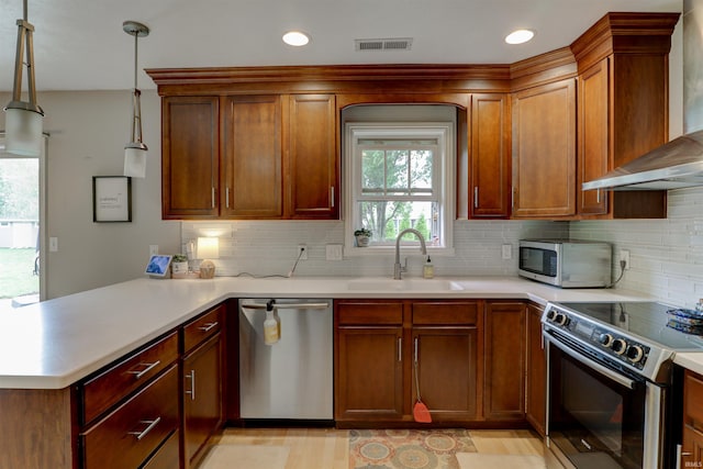 1444 Field Crest Ln, Jasper, IN 47546 - kitchen with stainless steel appliances, a sink, wall chimney range hood, a peninsula, and light countertops
