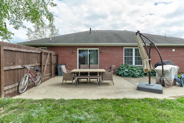 1444 Field Crest Ln, Jasper, IN 47546 - back of house with brick siding, a shingled roof, and a patio area