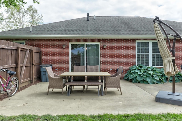 1444 Field Crest Ln, Jasper, IN 47546 - back of property with brick siding, roof with shingles, and a patio