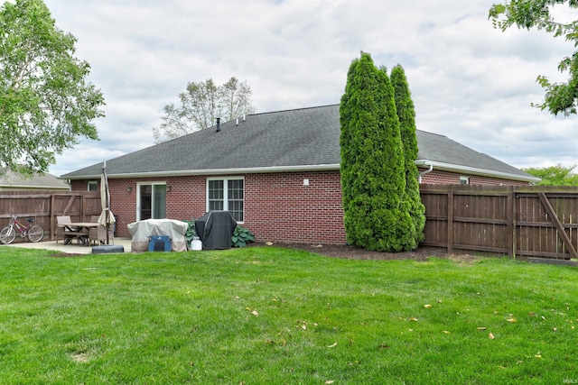 1444 Field Crest Ln, Jasper, IN 47546 - back of house with a patio area, roof with shingles, and brick siding