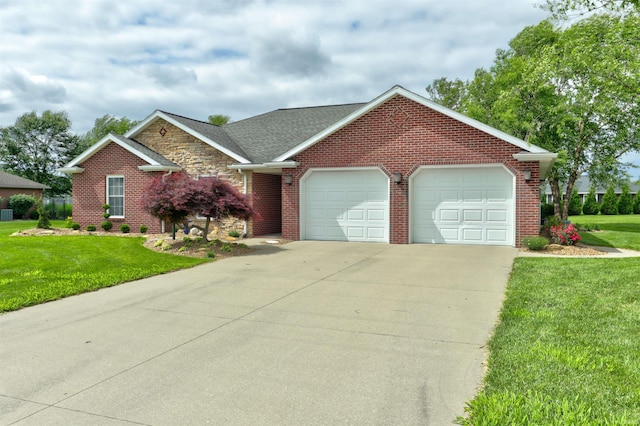 1444 Field Crest Ln, Jasper, IN 47546 - view of front facade with an attached garage, concrete driveway, brick siding, and a front yard