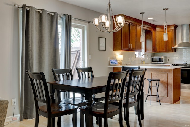 1444 Field Crest Ln, Jasper, IN 47546 - dining space featuring a chandelier, light wood finished floors, recessed lighting, and baseboards