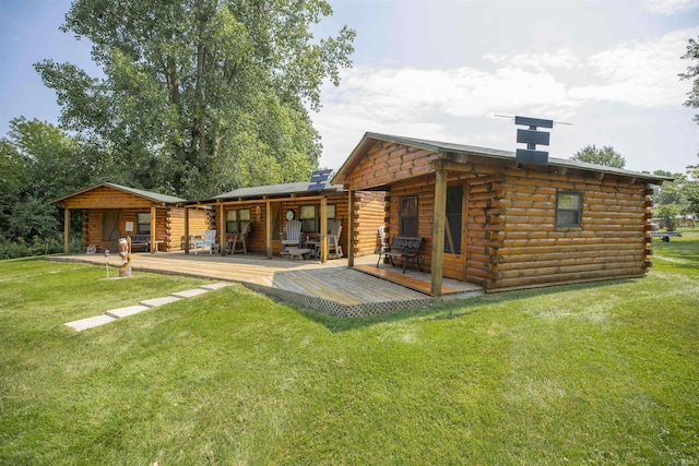 11029 E 350 S, Lagrange, IN 46761 - rear view of property with log siding, a chimney, a wooden deck, and a lawn