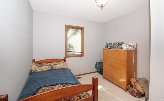 1220 N 290, Angola, IN 46703 - bedroom with light colored carpet, a textured ceiling, and baseboards