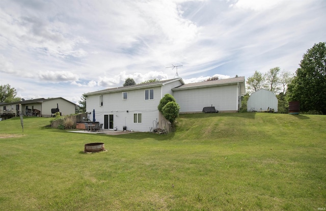 1220 N 290, Angola, IN 46703 - back of house with a fire pit, a yard, and a patio area