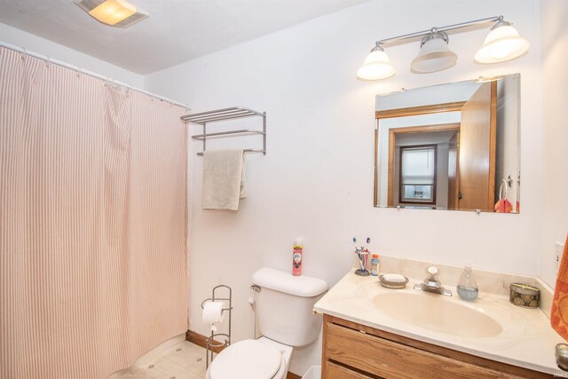 1220 N 290, Angola, IN 46703 - bathroom featuring vanity, toilet, and curtained shower