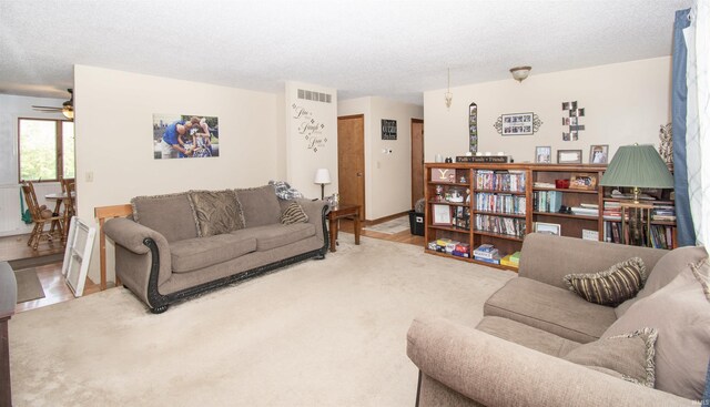 1220 N 290, Angola, IN 46703 - living area featuring wood finished floors, ceiling fan, and a textured ceiling