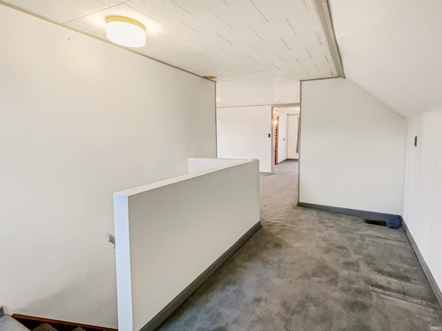 1029B Second Ave, Jasper, IN 47546 - hallway with an upstairs landing, carpet floors, and vaulted ceiling