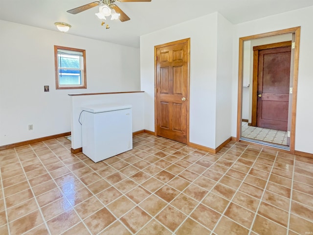 1029B Second Ave, Jasper, IN 47546 - empty room with a ceiling fan, light tile patterned flooring, and baseboards