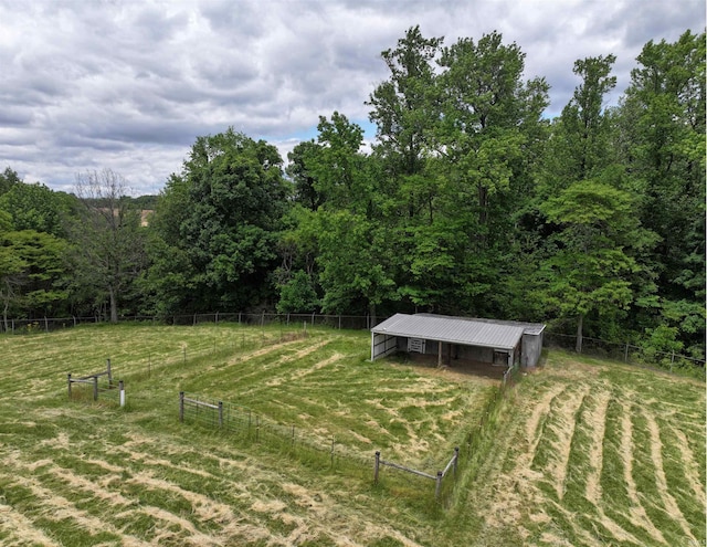 1029B Second Ave, Jasper, IN 47546 - view of yard featuring an outbuilding, a view of countryside, and a wooded view