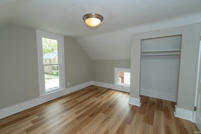 515 W Crawford St, Elkhart, IN 46514 - additional living space featuring lofted ceiling, wood finished floors, and baseboards