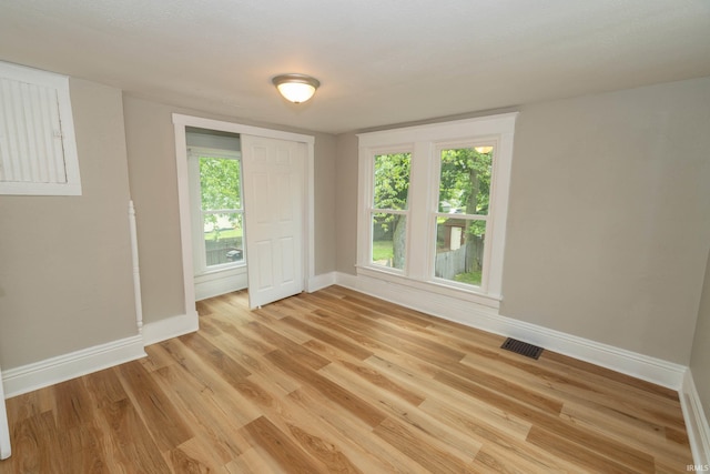 515 W Crawford St, Elkhart, IN 46514 - spare room featuring baseboards and light wood-type flooring