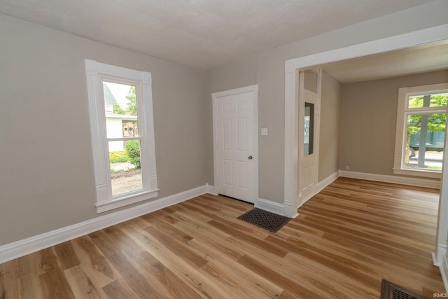 515 W Crawford St, Elkhart, IN 46514 - spare room featuring baseboards and light wood-style floors