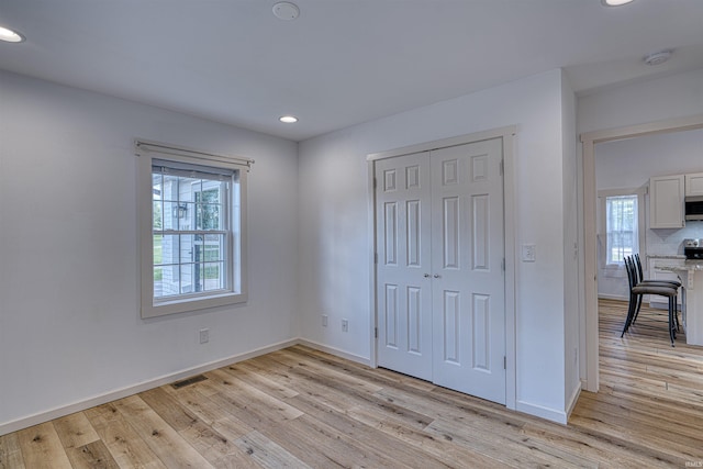 508 Polk St, Newburgh, IN 47630 - unfurnished bedroom with light wood finished floors, recessed lighting, baseboards, and a closet