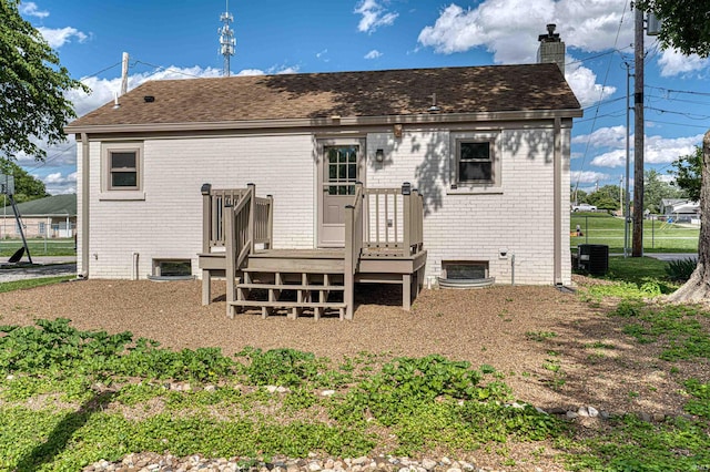 508 Polk St, Newburgh, IN 47630 - rear view of house with a wooden deck, a chimney, central air condition unit, and roof with shingles