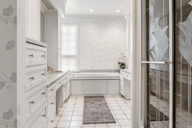 2314 Turnberry Ln, Fort Wayne, IN 46814 - full bathroom featuring crown molding, wallpapered walls, vanity, and a garden tub
