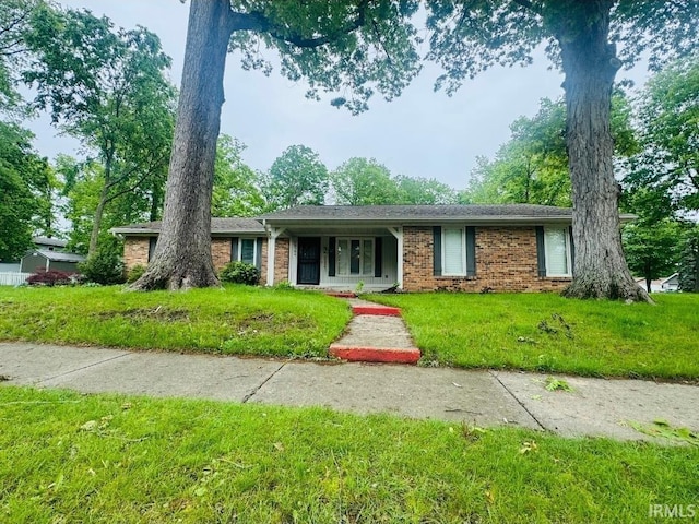 10704 Longwood Dr, Fort Wayne, IN 46845 - ranch-style house featuring brick siding and a front yard