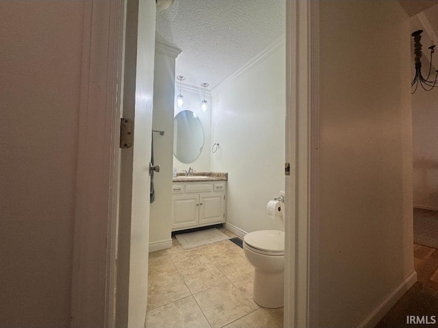 10704 Longwood Dr, Fort Wayne, IN 46845 - bathroom featuring ornamental molding, vanity, toilet, a textured ceiling, and tile patterned flooring