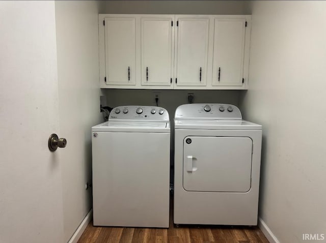 10704 Longwood Dr, Fort Wayne, IN 46845 - washroom with washing machine and dryer, cabinet space, dark wood-type flooring, and baseboards