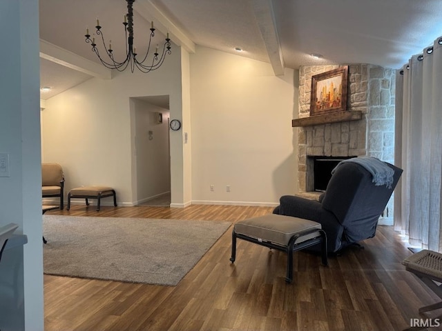10704 Longwood Dr, Fort Wayne, IN 46845 - living area with a fireplace, wood finished floors, baseboards, and a chandelier