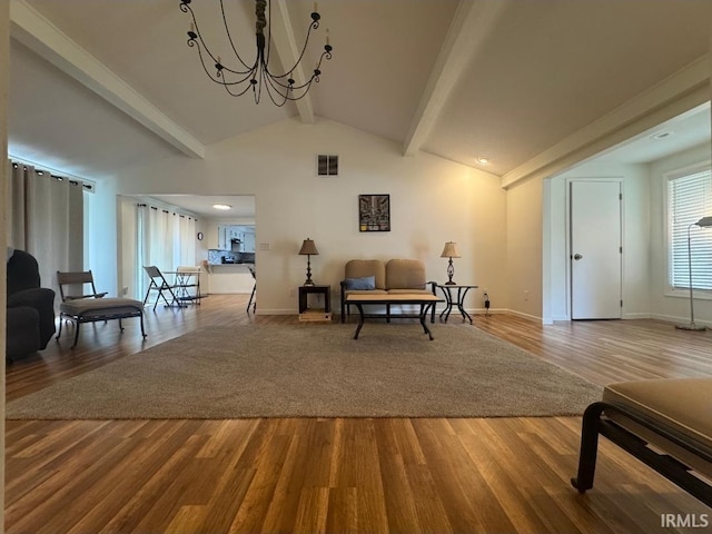 10704 Longwood Dr, Fort Wayne, IN 46845 - living area with a chandelier, wood finished floors, and baseboards