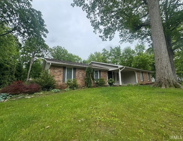 10704 Longwood Dr, Fort Wayne, IN 46845 - single story home with a front lawn and brick siding