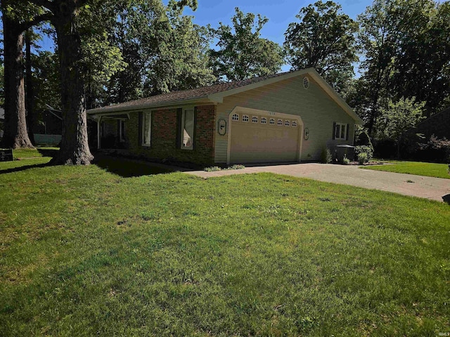 10704 Longwood Dr, Fort Wayne, IN 46845 - ranch-style house with an attached garage, concrete driveway, a front lawn, and brick siding