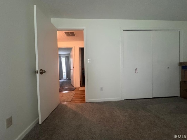 10704 Longwood Dr, Fort Wayne, IN 46845 - unfurnished bedroom featuring carpet floors, a closet, and baseboards