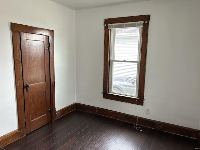 1338 Dewey St, Jasper, IN 47546 - empty room featuring baseboards and dark wood-style floors
