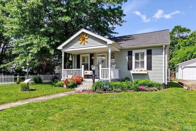 514 N Lemcke Ave, Evansville, IN 47712 - bungalow with covered porch, roof with shingles, and an outdoor structure