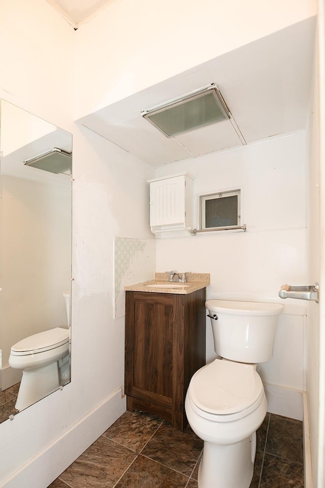 318 E Monroe St, Goshen, IN 46526 - half bath featuring toilet, baseboards, and vanity